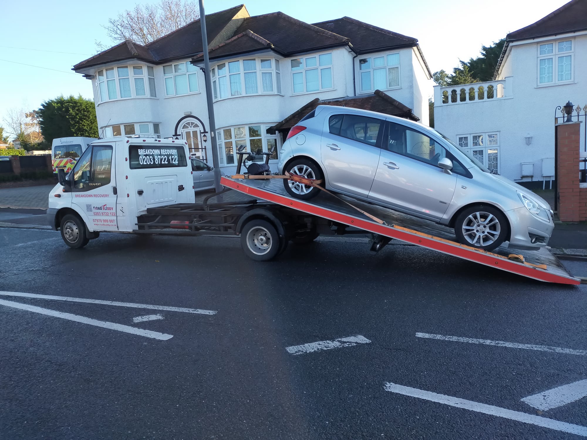 Road Buddy recovery truck loading a car during a breakdown recovery job in Leamington Spa