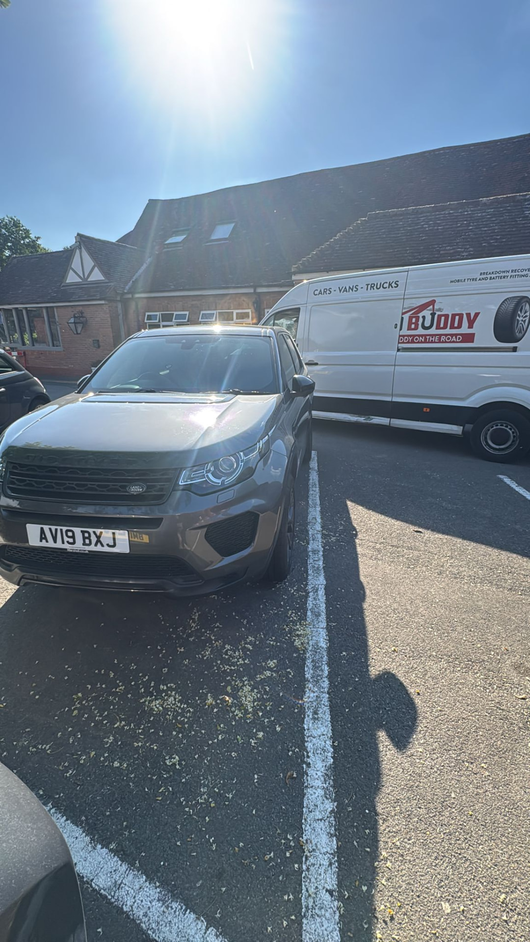 SUV parked next to the Road Buddy van during a tyre replacement in Warwick