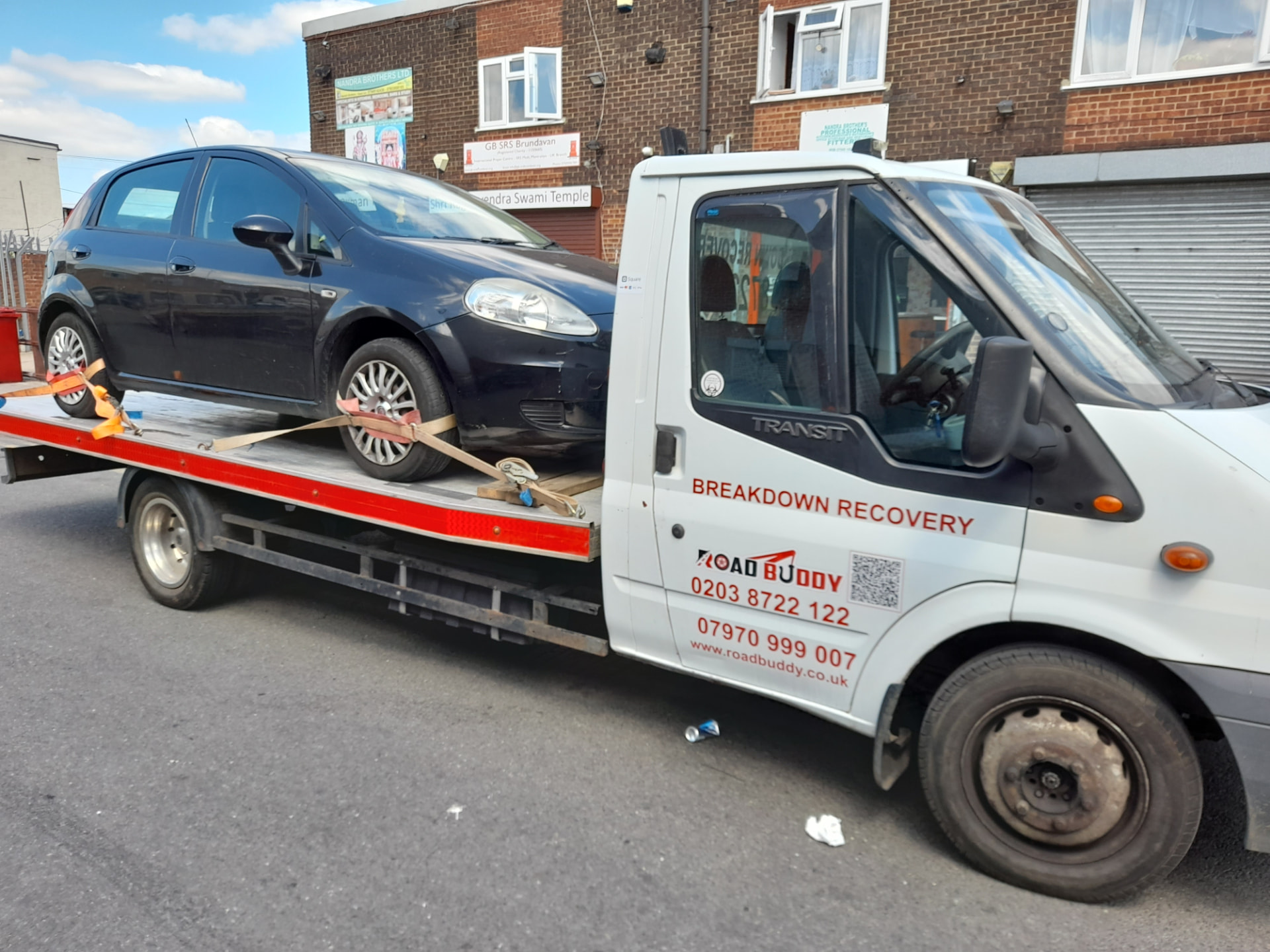 Road Buddy recovery truck loaded with a car during a breakdown recovery job in Coventry
