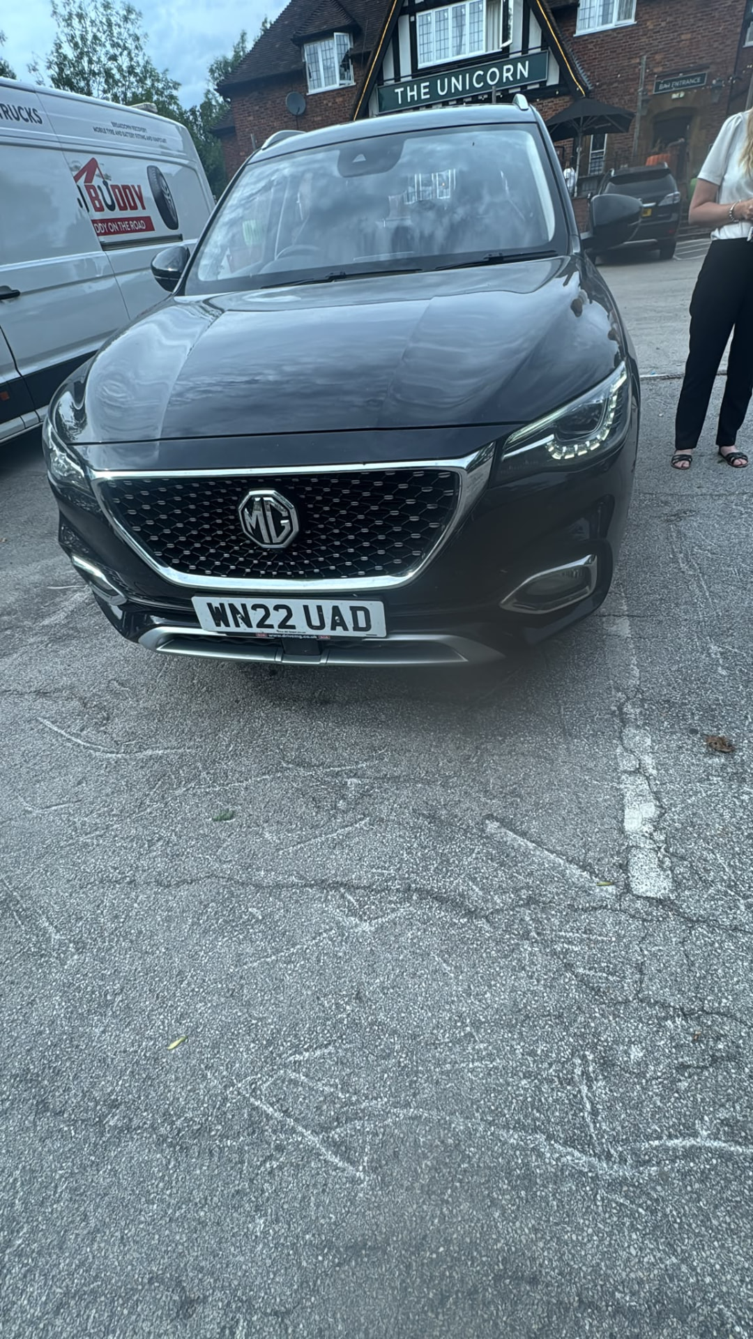 Dark SUV in a pub car park with the Road Buddy van alongside during a mobile tyre replacement in Birmingham