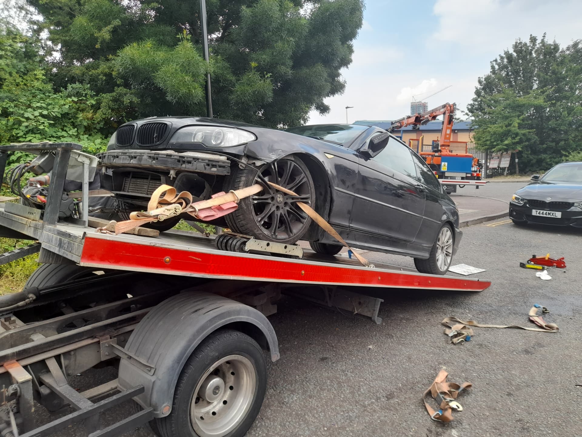 Non-running car strapped onto the Road Buddy recovery truck during vehicle transport in Worcester