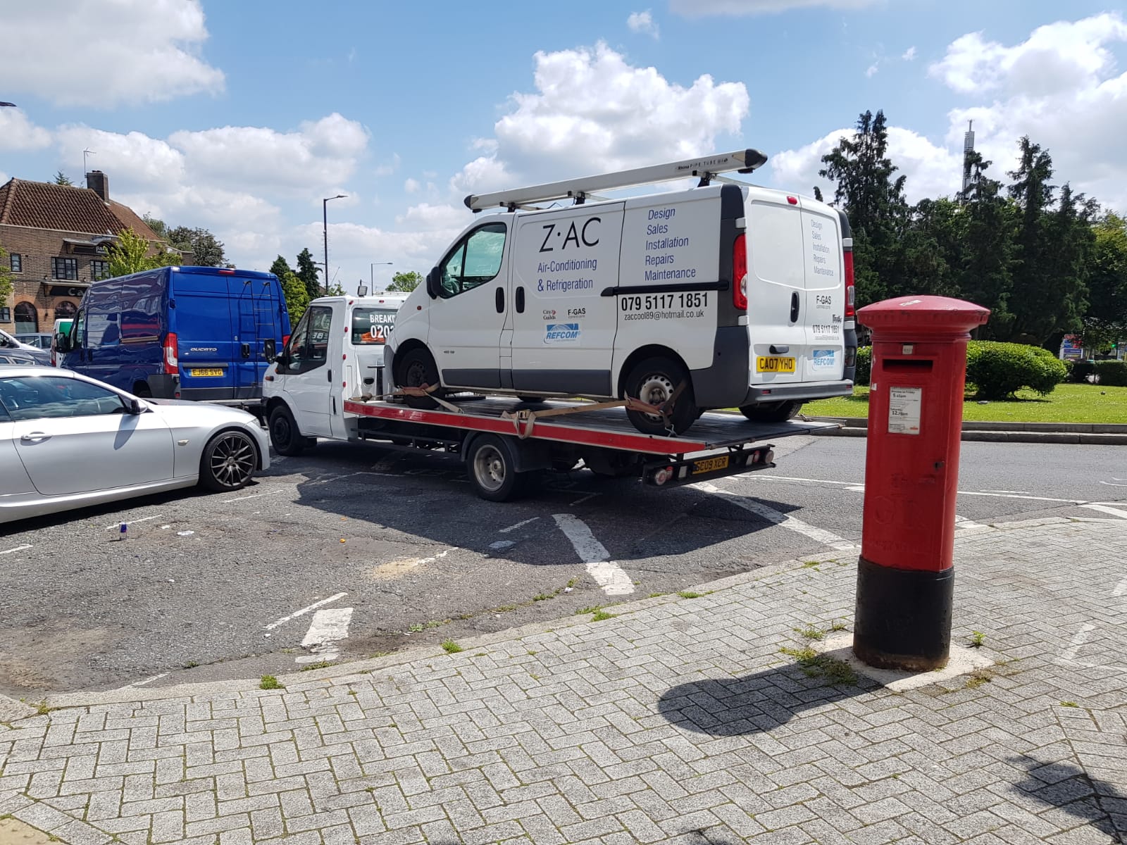Work van loaded on the Road Buddy recovery truck during a van recovery job in Northampton